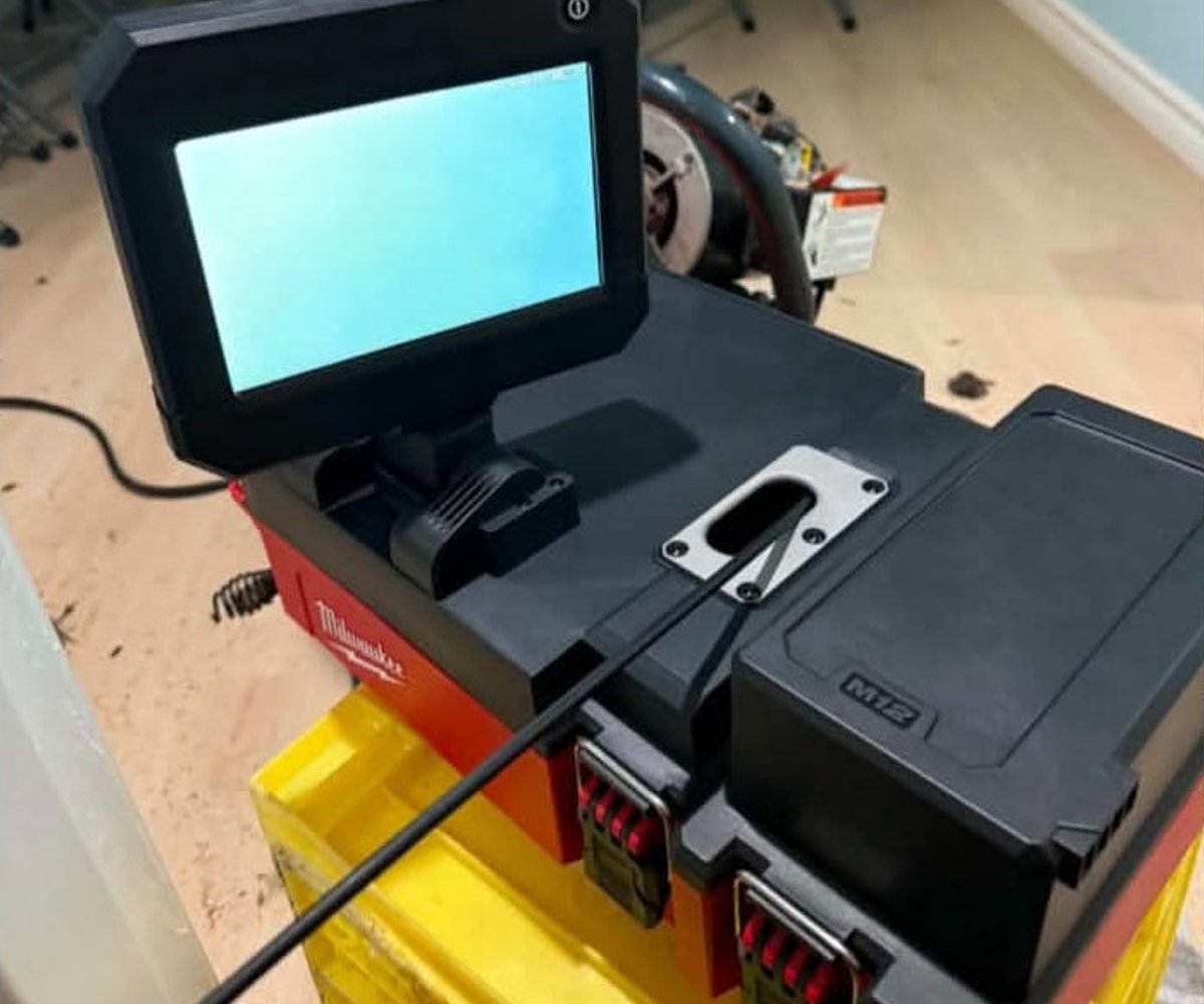 Drain camera inspection equipment beside an open drain pipe
