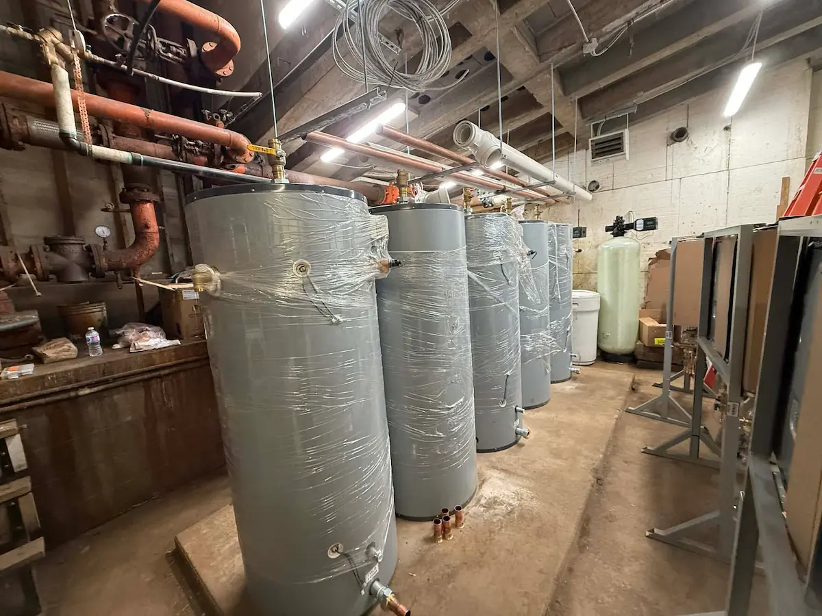 Mechanical room corner with large insulated tank and piping