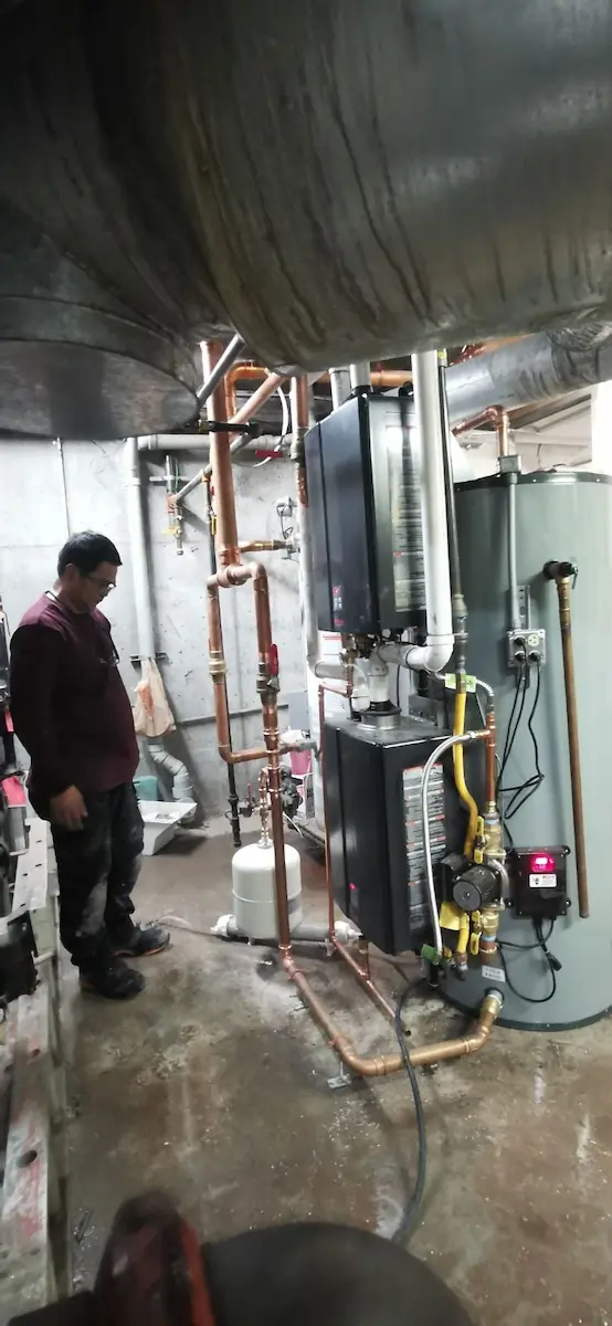 Technician repairing pipes