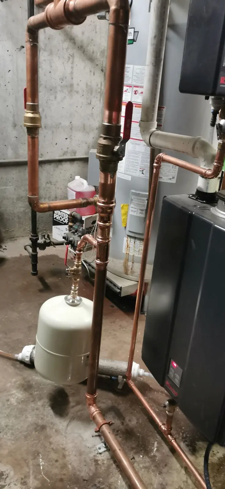 Mechanical room pipework connected to storage tanks